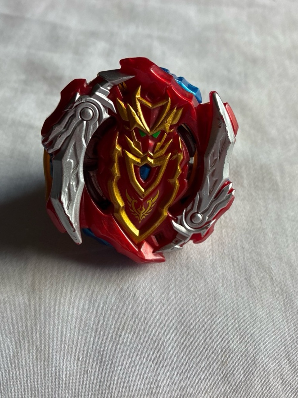Red and Gold Spinning Battle Top Toy with Silver Accents Beyblade